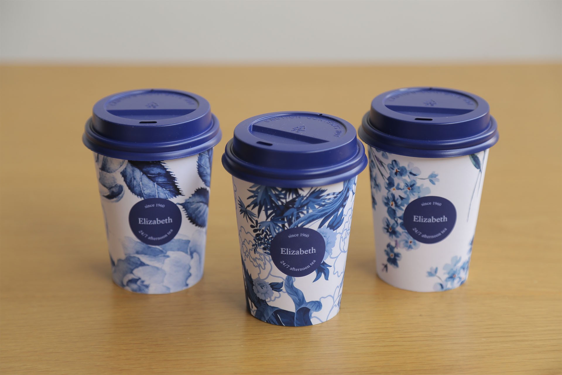 Photo of a man in a room using a tablet computer